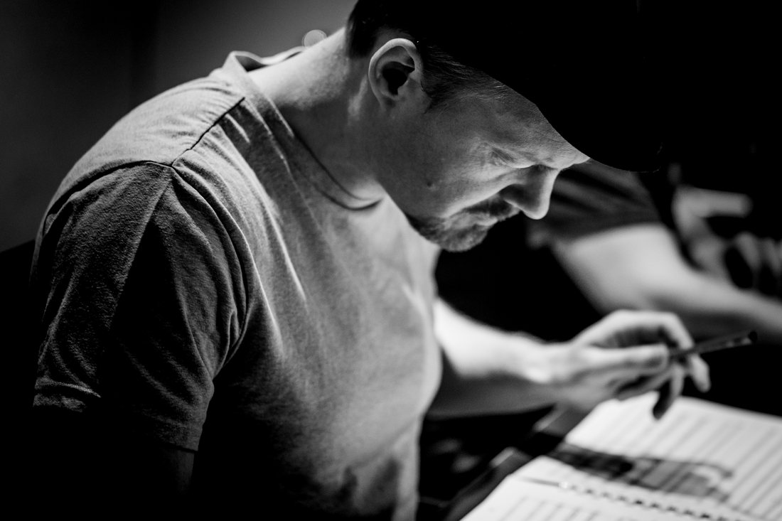 Alex Komlew at the desk